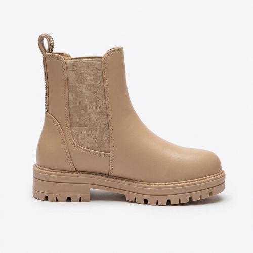 Botte enfant beige style Chelsea, élastique latéral et semelle robuste antidérapante.
