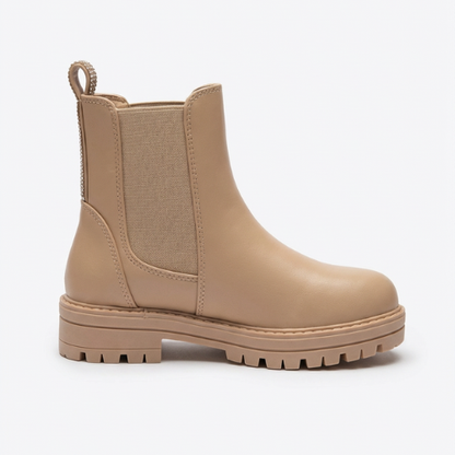 Botte enfant beige style Chelsea, élastique latéral et semelle robuste antidérapante.
